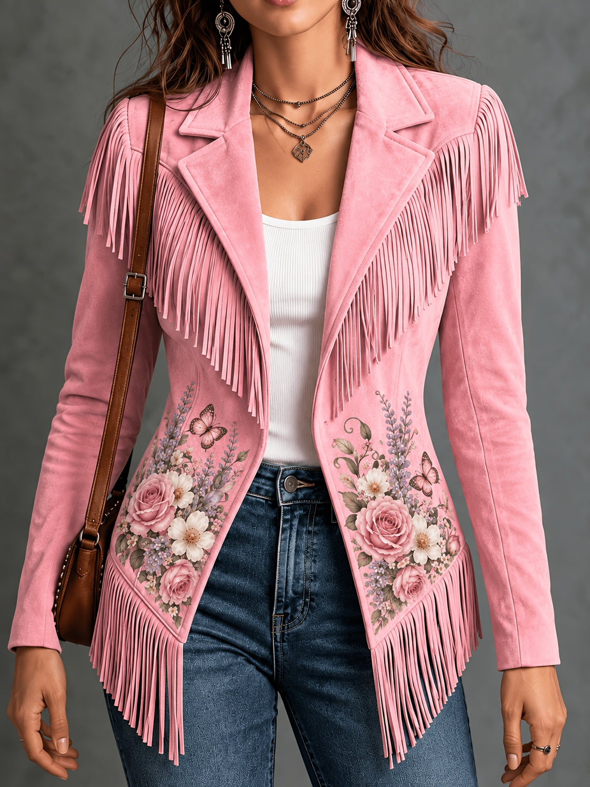 Pink women's jacket with floral details and fringe along the shoulders and hem