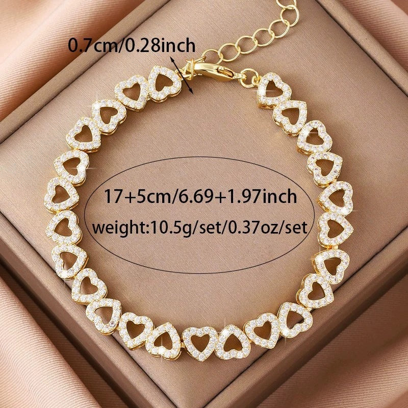 Heart charm bracelet layered with other jewelry - view 6