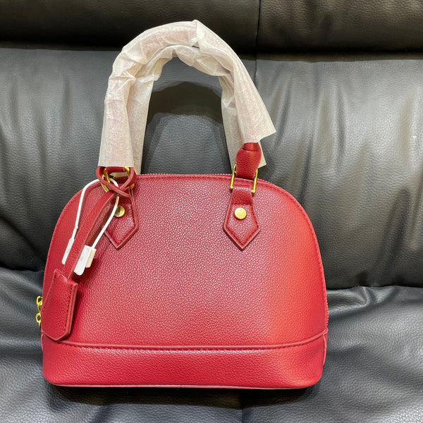 Shell crossbody bag shown from front angle