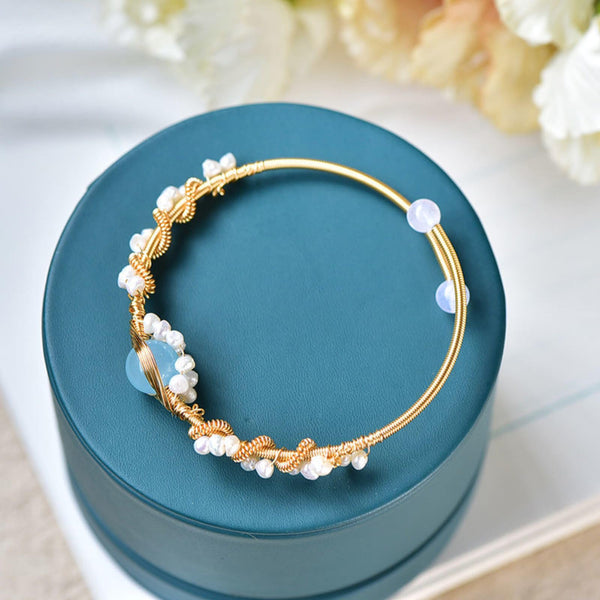 Product detail photo of Gold Tone Pearl Braided Bracelet, gold tone pearl braided bracelet