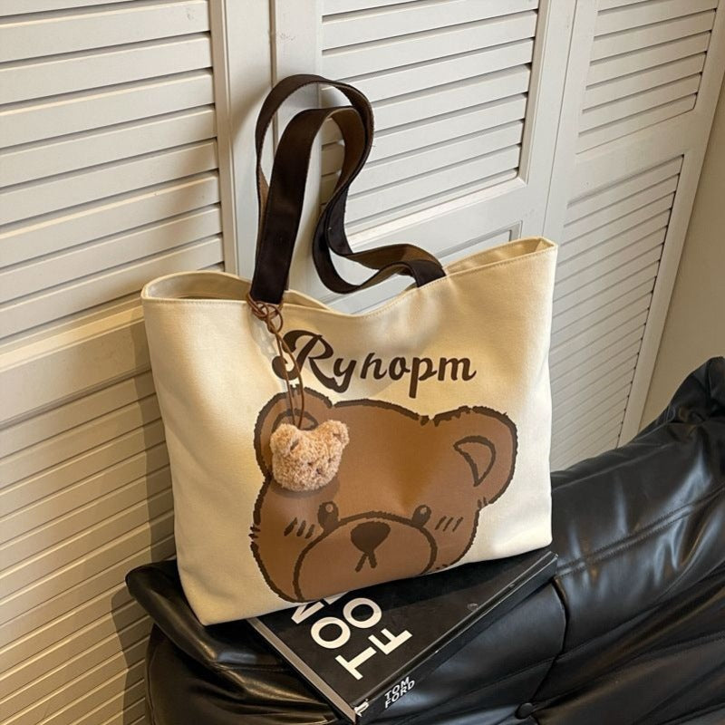 Bear motif bag shown from side angle