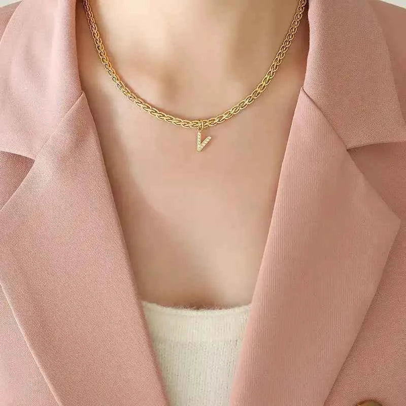 Letter pendant necklace in brass with zircon inlay — additional view 6